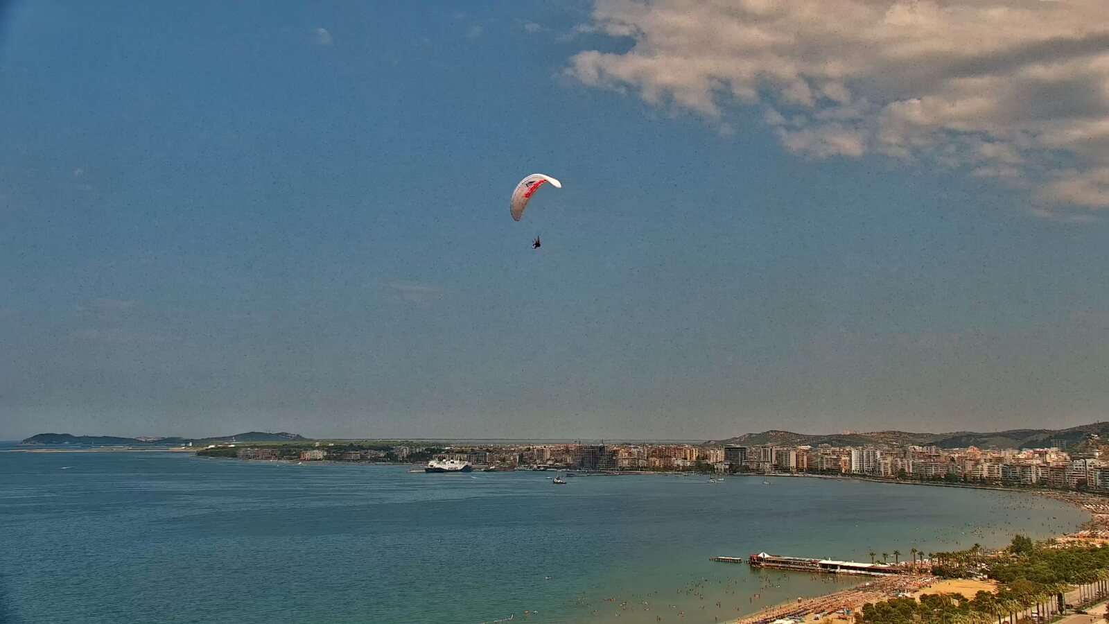 Paraglider above a wide view of Vlora Bay